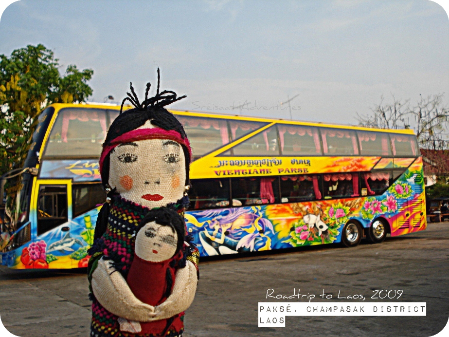 Khmer Iggy posing in front of the overnight tourist bus that took us to Vientiane.